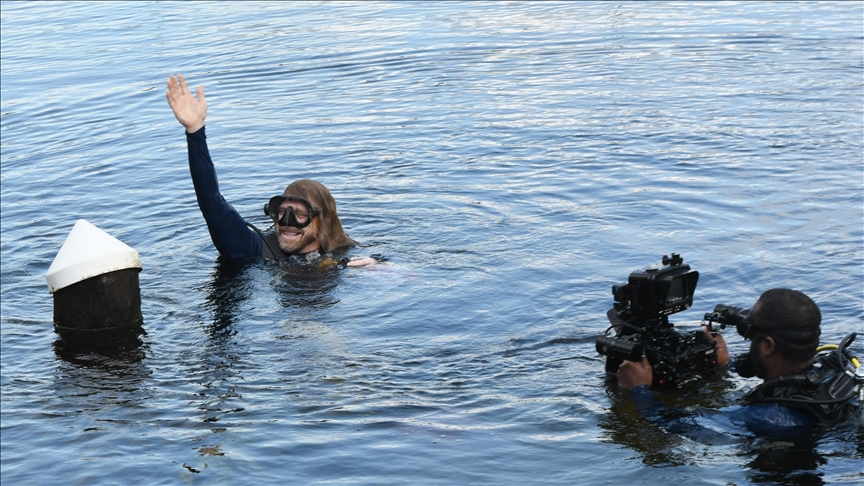 Florida scientist resurfaces after breaking record of living underwater