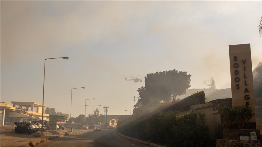 Europe's largest holiday firm cancels flights to Rhodes island as wildfires rage
