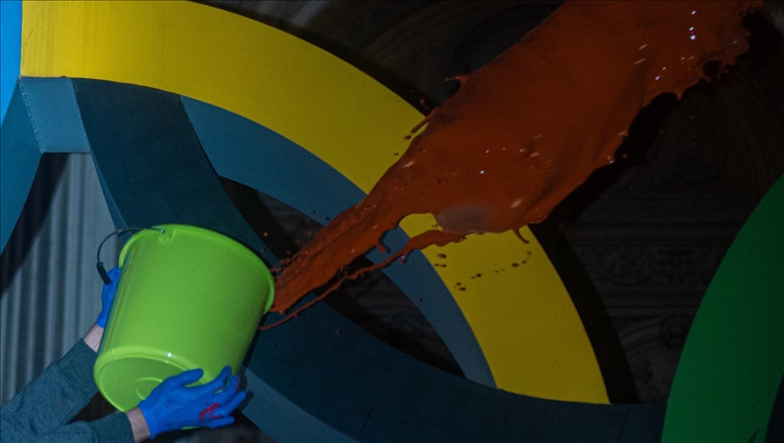 Climate activists spread fake blood on Olympic rings monument in Paris