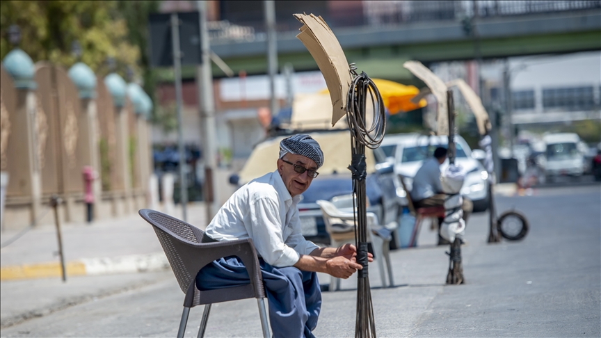 Day workers try to earn living in northern Iraq in temps higher than 113F