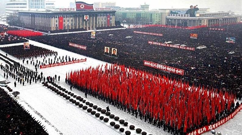 North Korea’s Kim shares stage with Russian defense chief at military parade