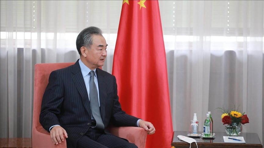 China’s Wang Yi wins praise for removing necktie