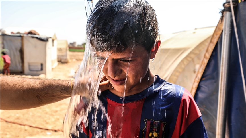 Syrians in Idlib refugee camp struggle to survive in tents as mercury soars to 50°C