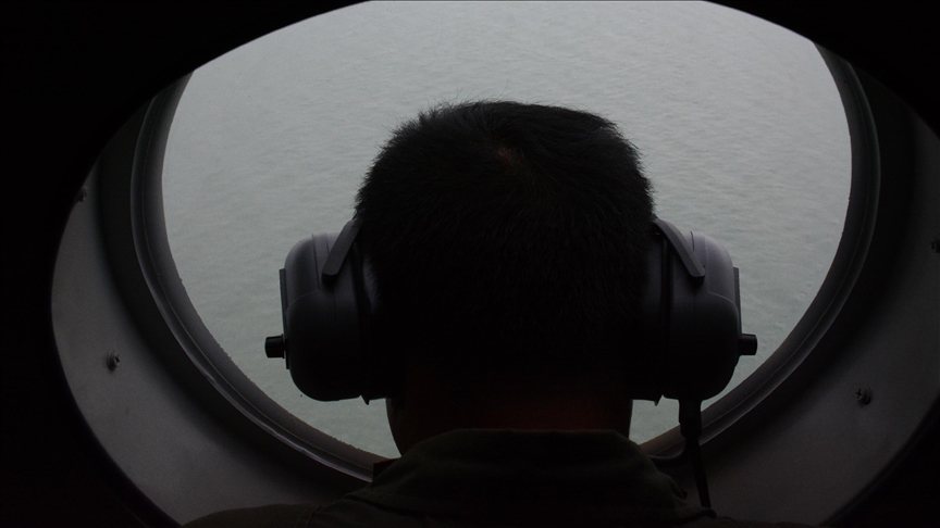China says it removed floating barriers in disputed waters, contradicting Philippines