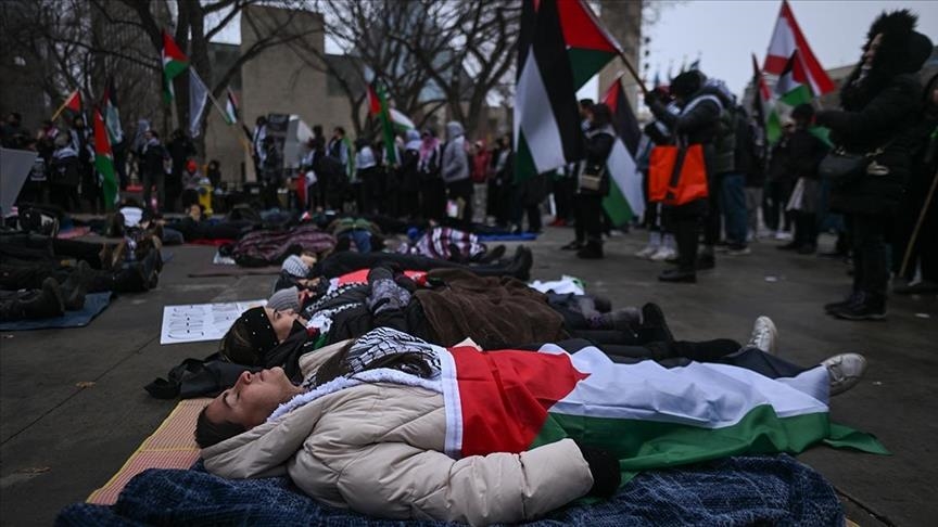 Demonstrators in Norway wear shrouds to decry killing of civilians in Gaza