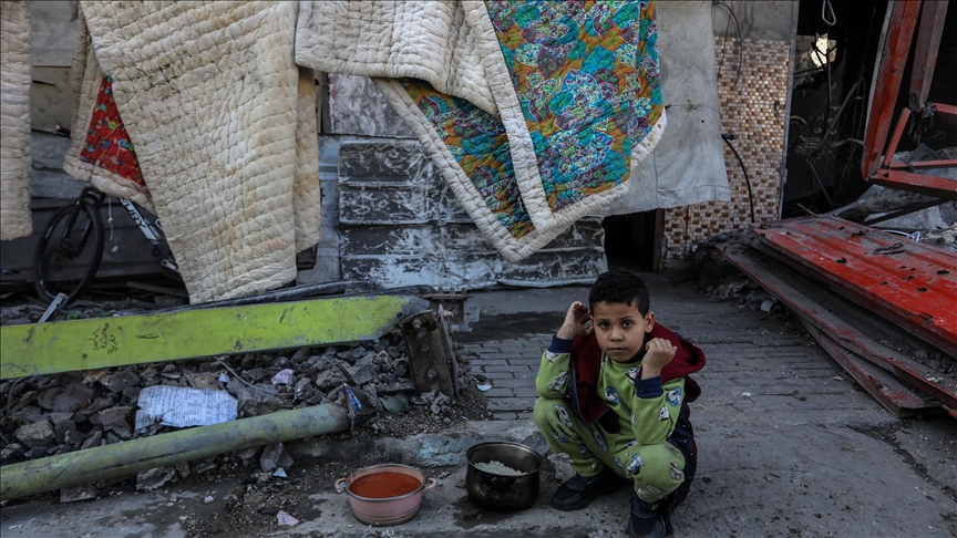Gazans buying used clothing to protect their children from cold