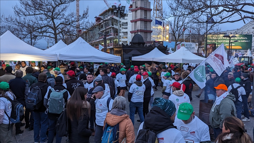 French farmers storm major Paris farm fair, surround President Macron's car