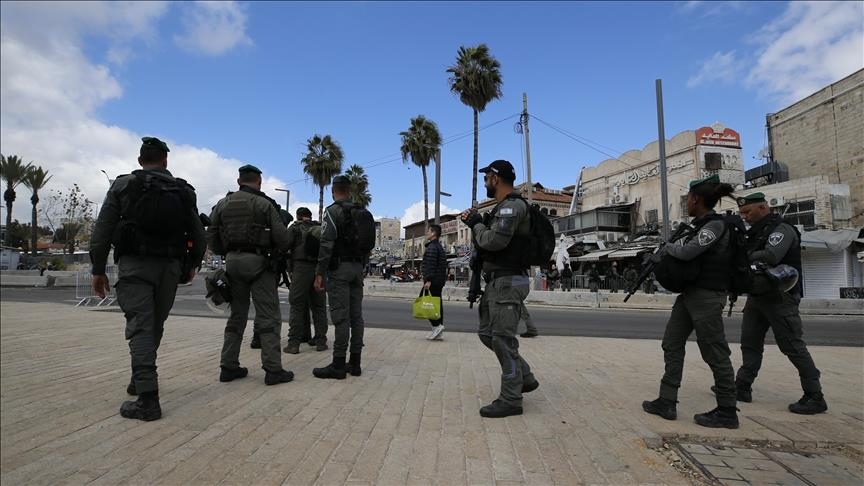 Israeli soldiers assault Palestinian child over T-shirt emblazoned with gun