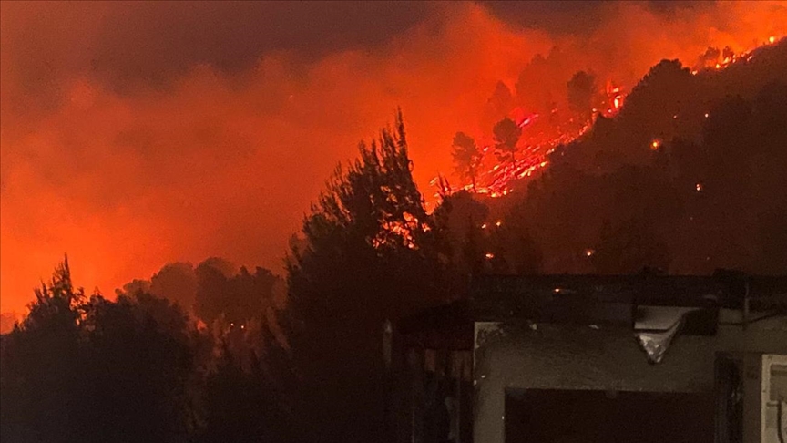 Israeli firefighters battle to extinguish fires after Hezbollah rocket fire