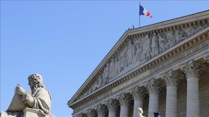 Left-wing lawmakers attend French parliament session wearing clothing representing Palestinian flag