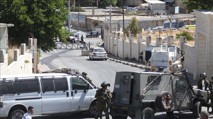 Israeli army shoots Palestinian child, runs over young man in West Bank raid