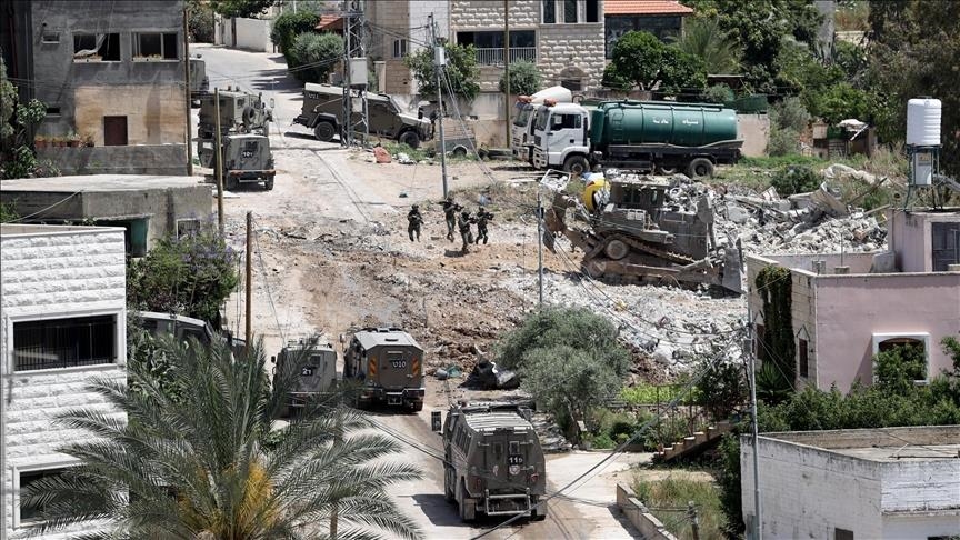 Israeli army leaves destroyed military vehicle behind in Gaza neighborhood