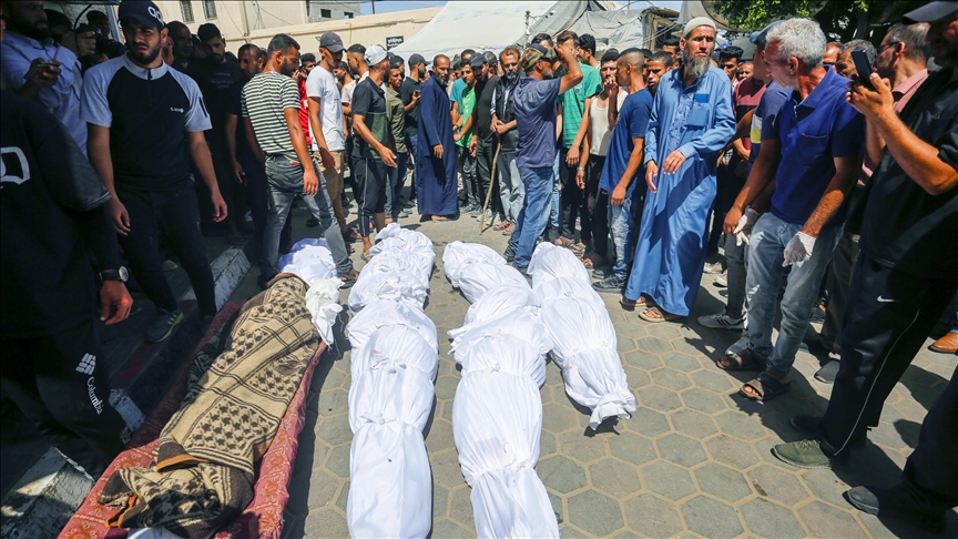 Palestinians retrieve bodies of 12 people buried by Israeli forces at Gaza hospital