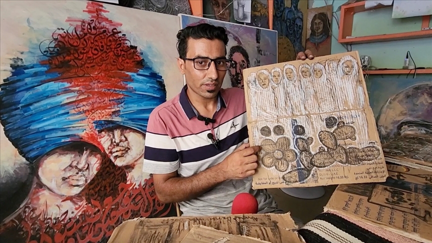 Палестинский художник рисует на коробках с гумпомощью