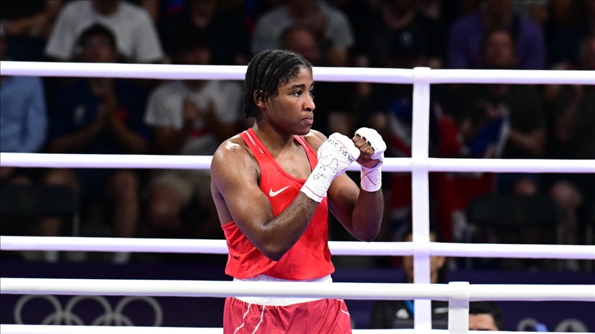 Boxer Cindy Ngamba guarantees 1st-ever medal for IOC Refugee Olympic Team