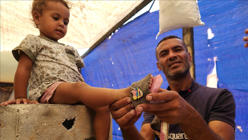 Palestinians resort to makeshift ‘clogs’ as shoes have become scarce due to Israeli attacks, embargo