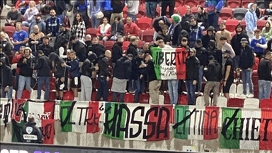 Italian fans turn backs during Israeli anthem at international football game