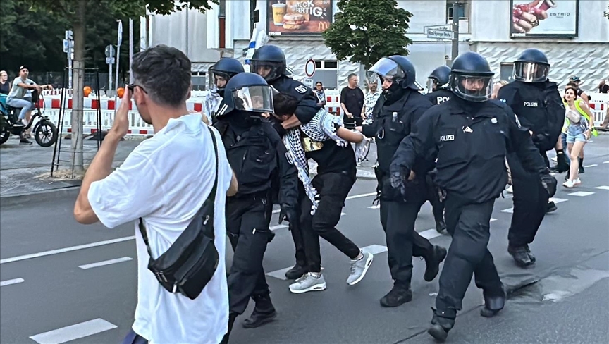 German police assault football fan carrying Palestinian flag