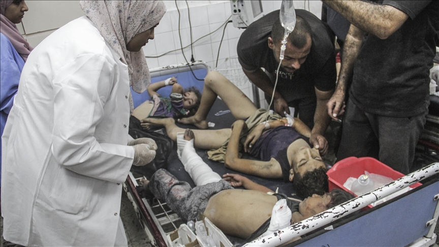 Palestinians bury their dead without shrouds as Israel deepens assault on northern Gaza