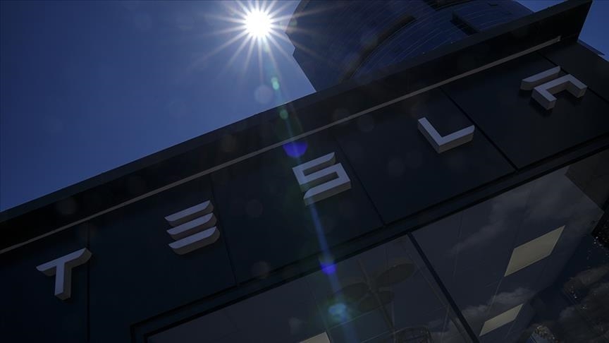 Tesla shares soar to record high