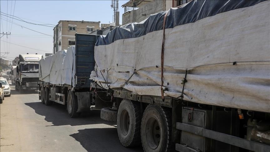 Aid trucks prepare to enter war-torn Gaza as ceasefire begins
