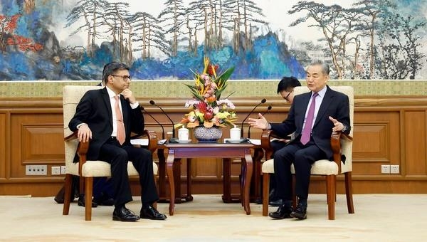 In boost to ties, China's top diplomat hosts visiting Indian official