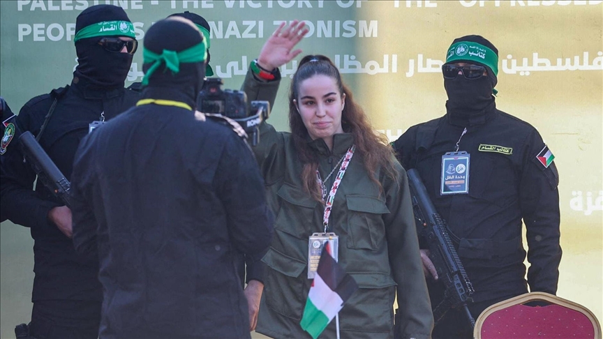 FEATURE - Hamas mocks Israeli army insignia during handover of captive soldier in Jabalia