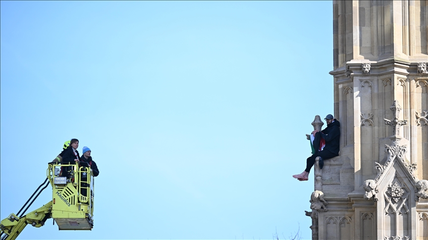 Protester scales London’s Big Ben to wave Palestinian Flag