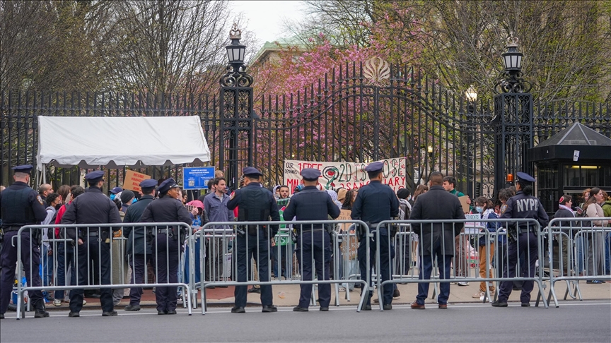 Protesters chain themselves to Columbia University campus gates to call for activists' release