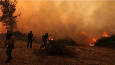 Large wildfire rages near Athens, forcing evacuations