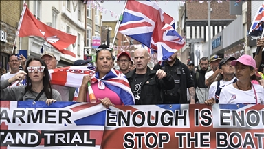 Anti-migrant, anti-racism demonstrators clash outside asylum seeker hotel in UK