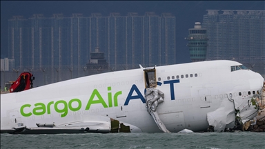2 killed after cargo plane slides off runway in Hong Kong