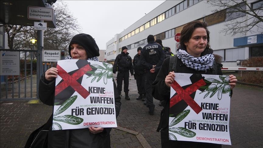 Activists chain themselves to railway tracks in Hamburg to protest German arms exports to Israel