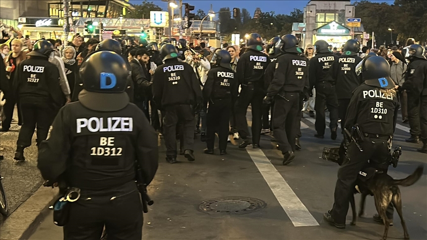 Protesters walk out as German chancellor speaks at integration awards ceremony