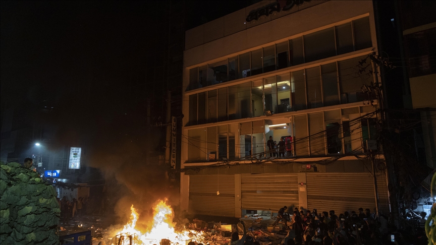 Protests over killing of Bangladeshi political activist continue, with several buildings damaged in arson attacks