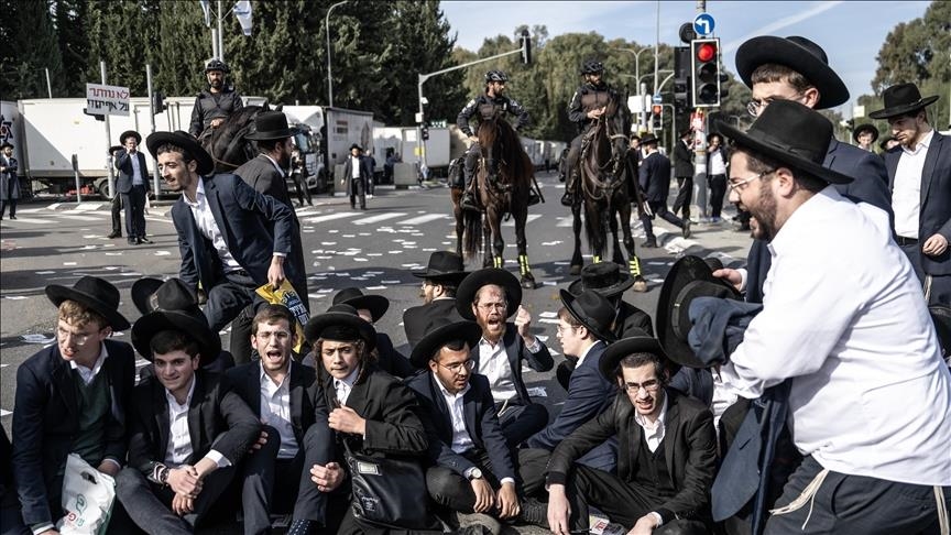 Dozens of ultra-Orthodox Jews block key road near Tel Aviv to protest arrest of draft evader