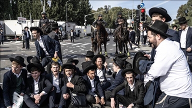Dozens of ultra-Orthodox Jews block key road near Tel Aviv to protest arrest of draft evader
