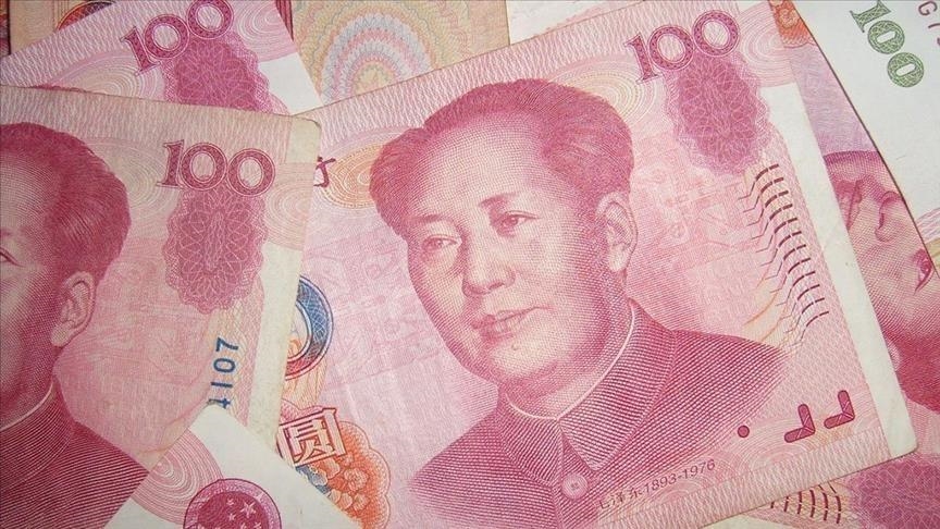 Yuan strengthens past key level as dollar weakens on tariff tensions