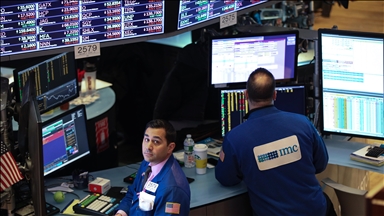 US stocks end mostly lower after volatile session as oil swings sharply