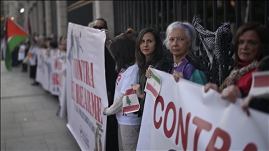 Protesters in Madrid form human chain to oppose war in Middle East