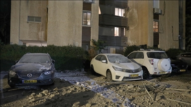 Several injured as falling fragments from Iranian cluster missile hit buildings in Tel Aviv