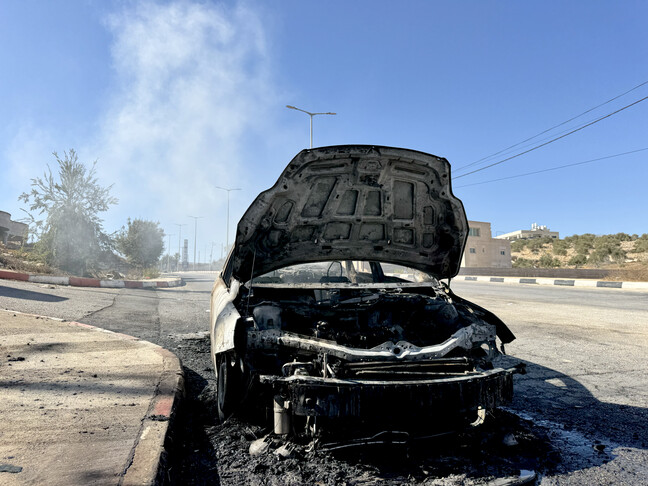 Israeli forces attack Palestinian, burn cars in West Bank