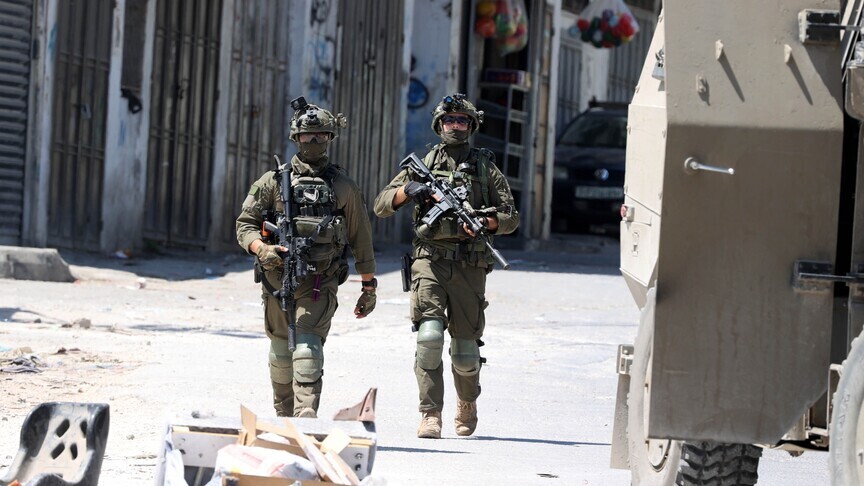 Israeli forces raid Palestinian town, surround mosque northwest of East Jerusalem