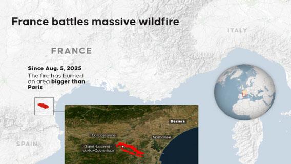 France battles massive wildfire