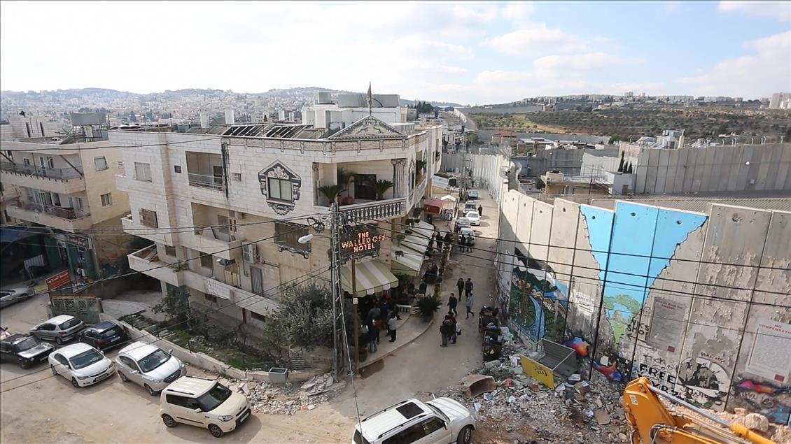 Street artist Banksy designs "The Walled Off" hotel in Bethlehem