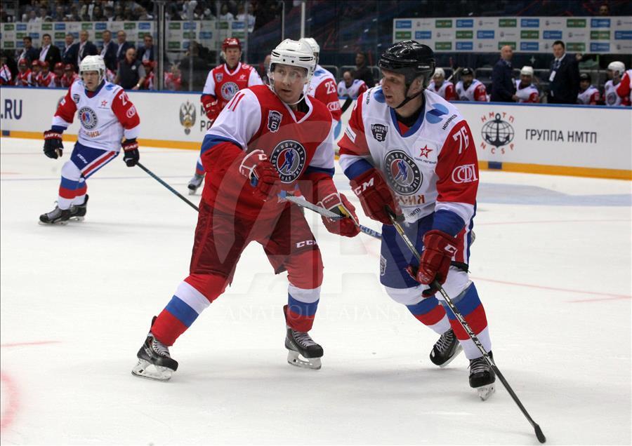 Russian President Vladimir Putin plays in ice hockey festival