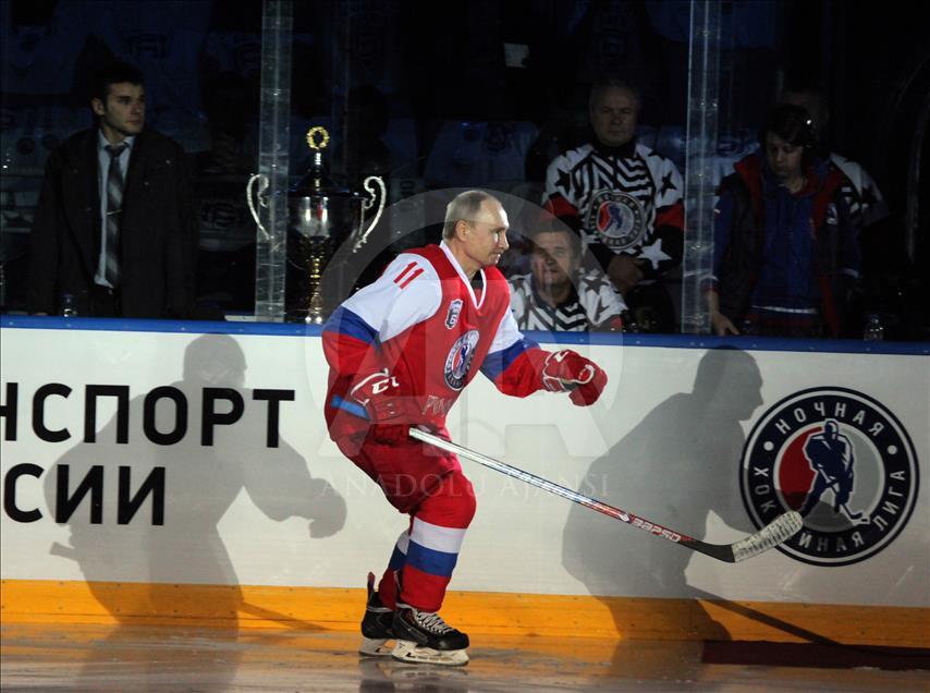 Russian President Vladimir Putin plays in ice hockey festival