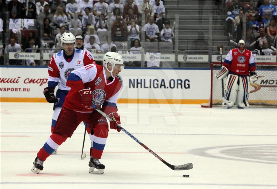 Russian President Vladimir Putin plays in ice hockey festival