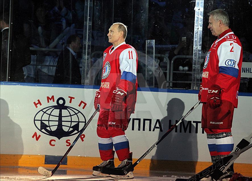 Russian President Vladimir Putin plays in ice hockey festival
