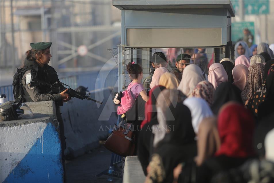 Passing through Qalandiya checkpoint for the second Friday prayer of Ramadan